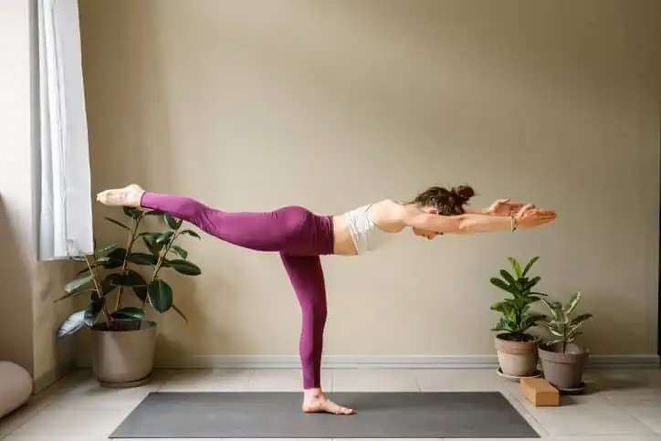Woman doing Yoga exercise Midlands  to help with toning the body. 